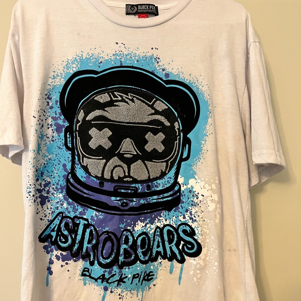 White graphic tee with monkey and blue pain splatter